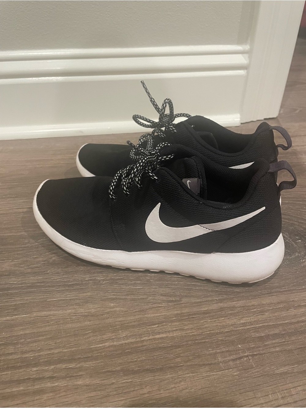 Nike Women’s Black and White Slip-On Style Athletic Sneakers